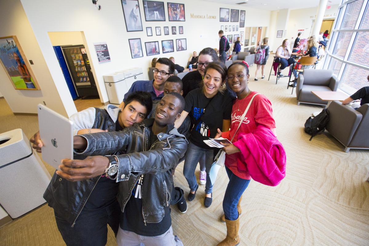 Diverse group of teenagers take a selfie