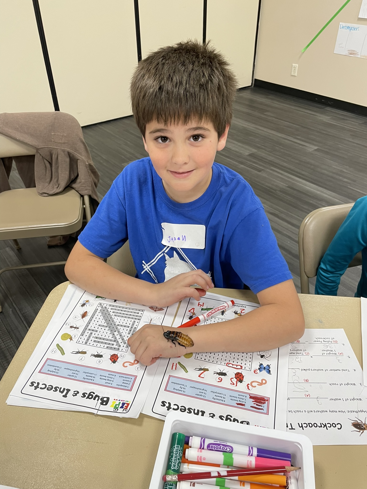 4-H youth attends a workshop that included Madagascar Hissing Cockroaches