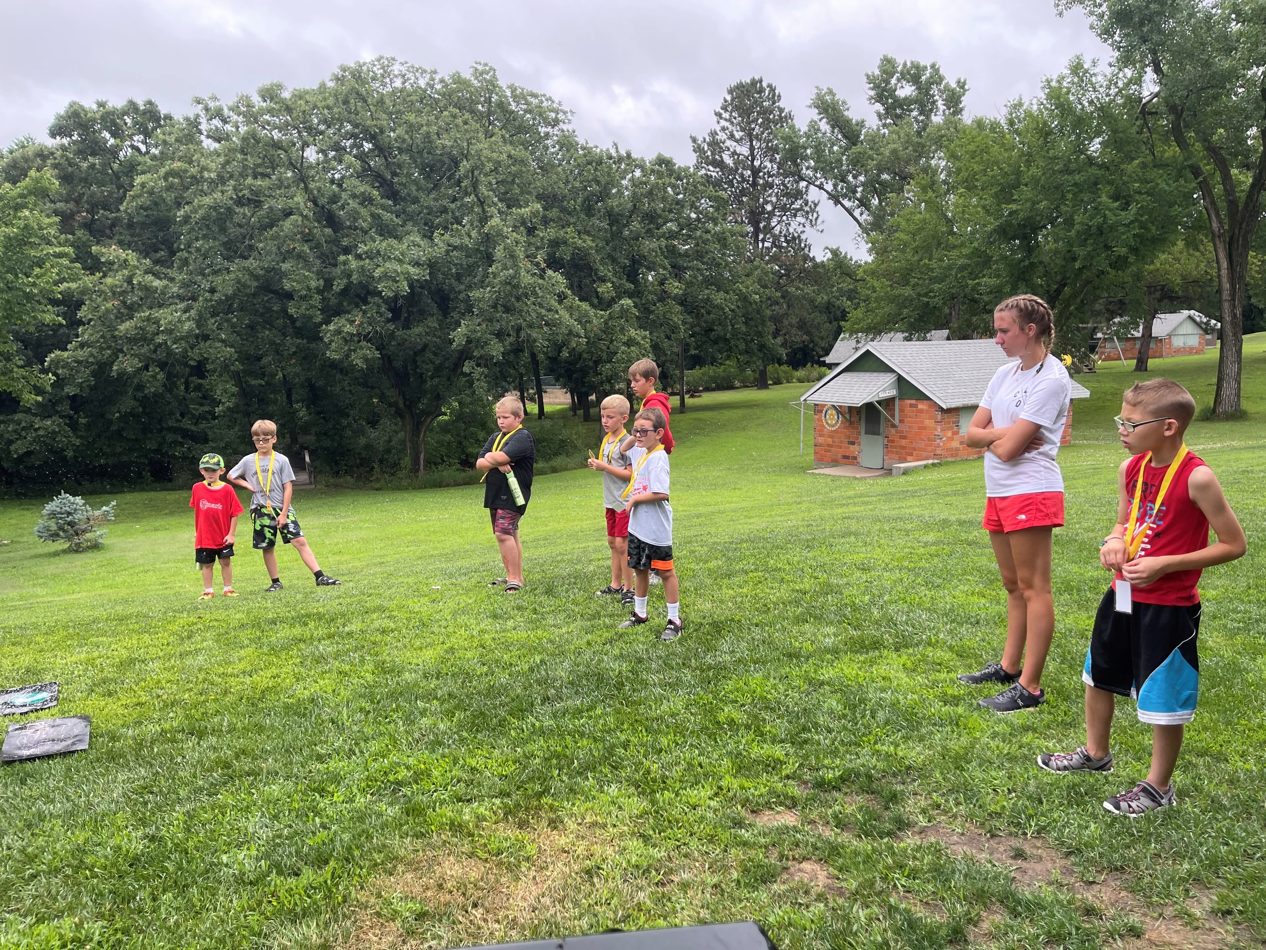 Campers playing a game outside on the grass