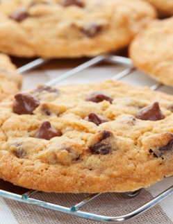 Chocolate chip cookies cooling on a metal rack