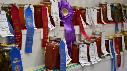 jars of vegetables with ribbons