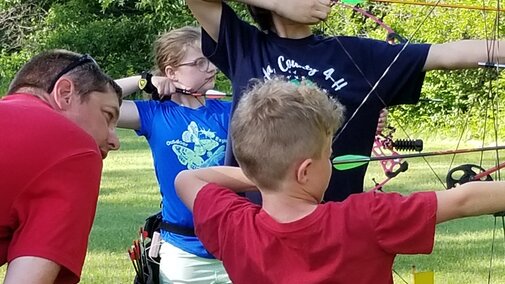Kids shooting archery