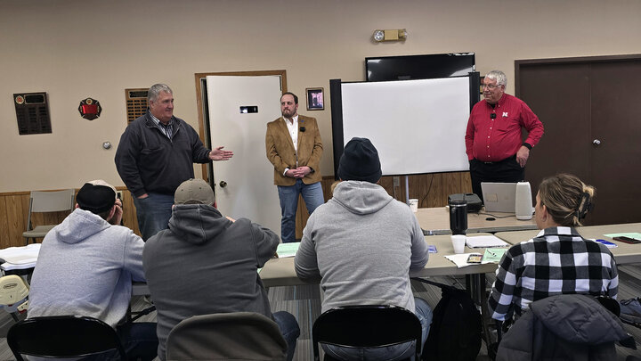 Steve Tucker, Robert Ellis, and Paul Jasa discussing a question