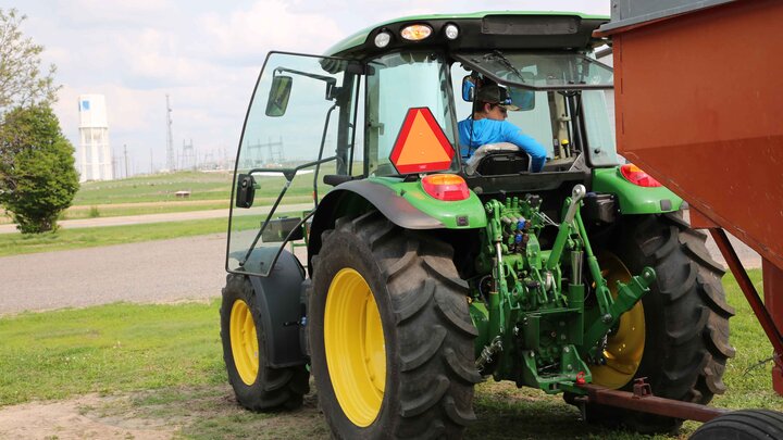 youth driving tractor