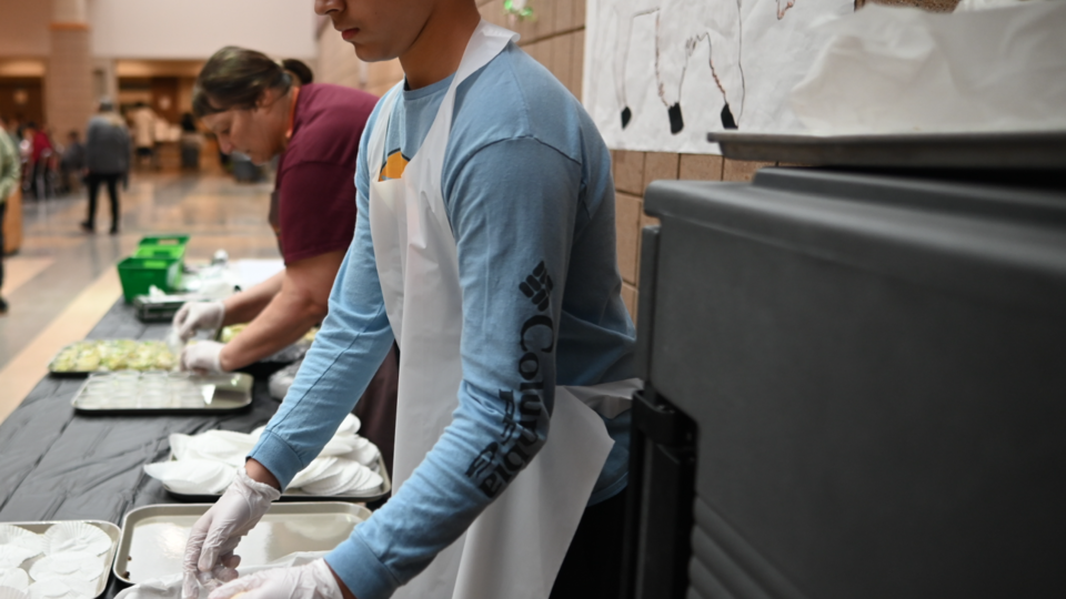 Chefs preparing food on trays