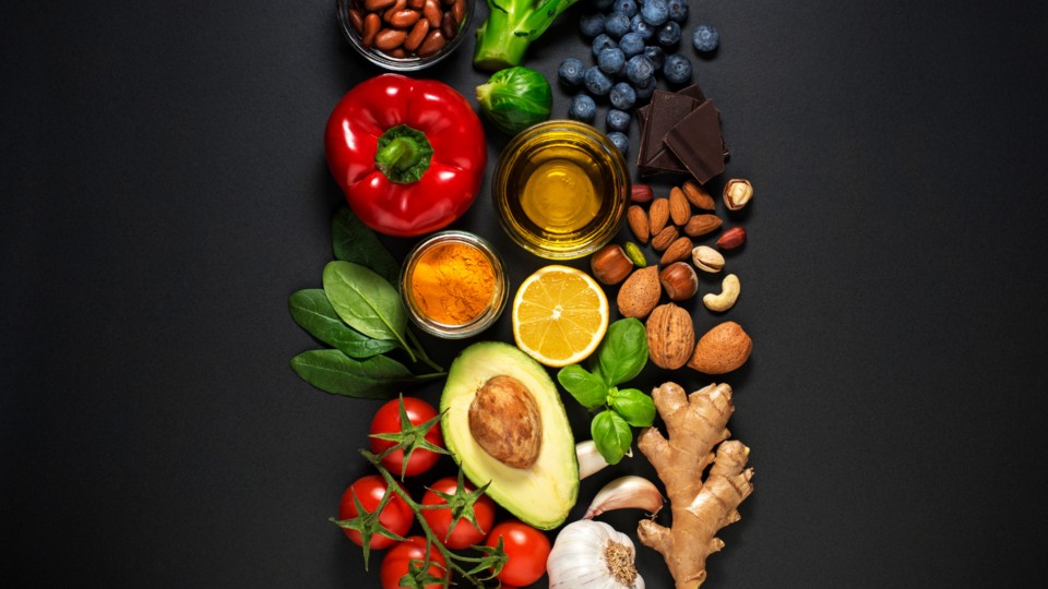 A variety of healthy fruits, vegetables, nuts, oils and spices
