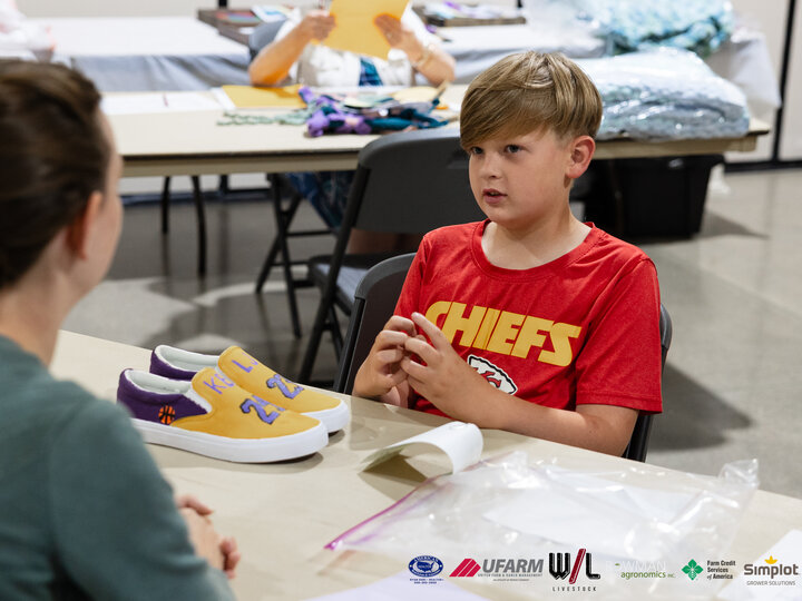 4-H youth doing a static interview with a judge at the 2025 Buffalo County Fair 