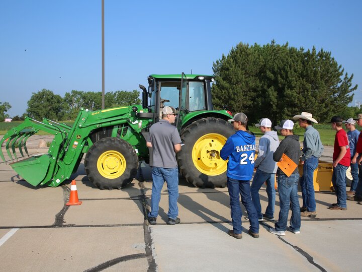Instructor teaching youth about tractor safety
