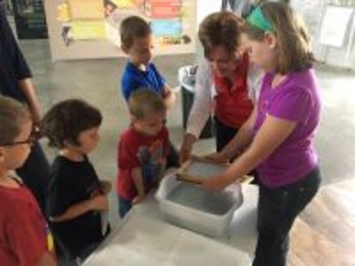 DeVries models how to make seed paper from Learn, Grow, Eat and Go! for early childhood providers at Raising Nebraska