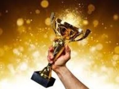 Hand holding a trophy