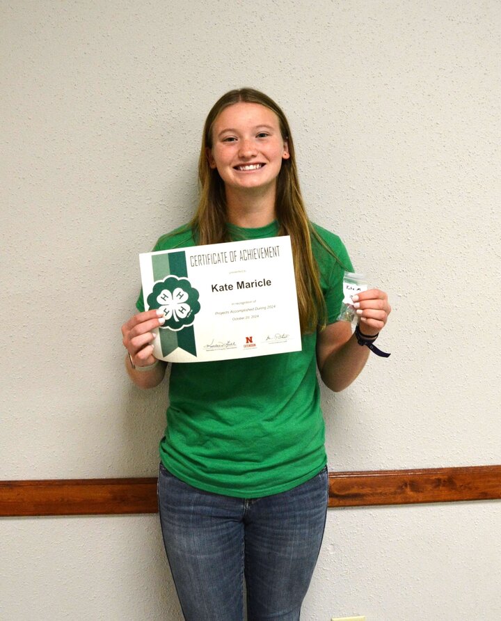 4-H member with membership award