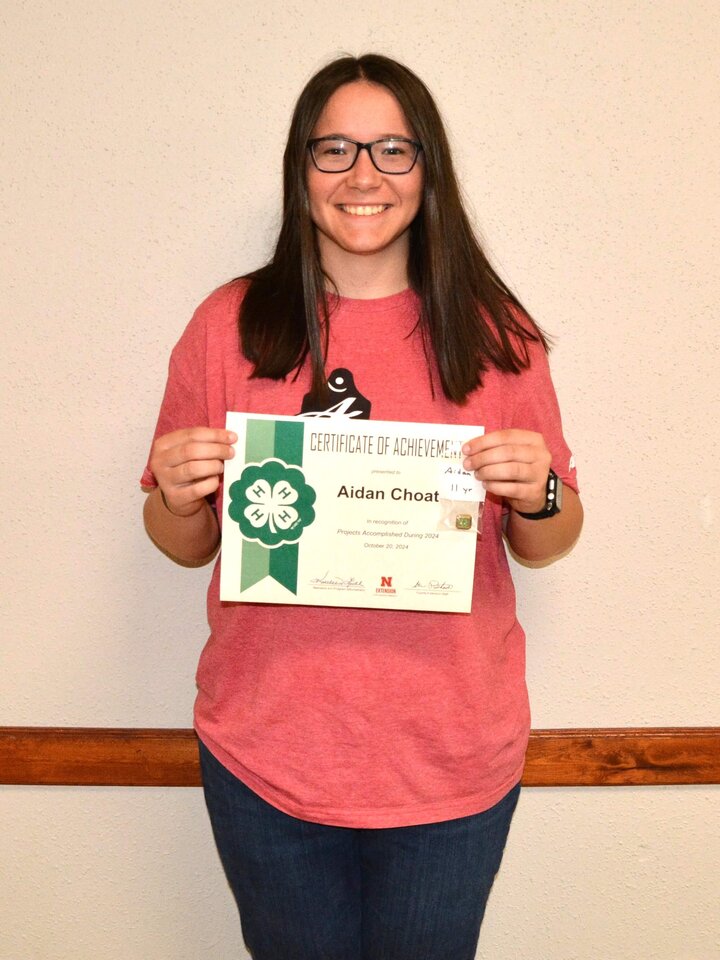 4-H member with membership award