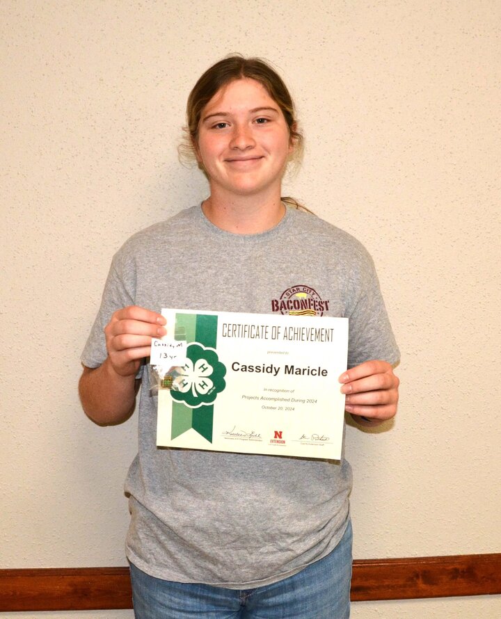 4-H member with membership award