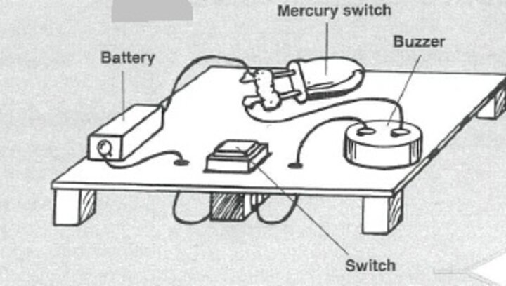 back and white diagram of an alarm indication the battery, switch, buzzer, and mercury switch locations