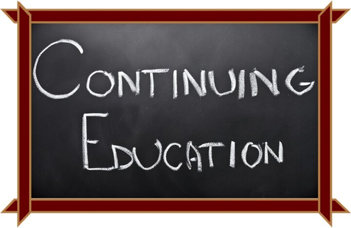 Continuing Education written in white on a blackboard