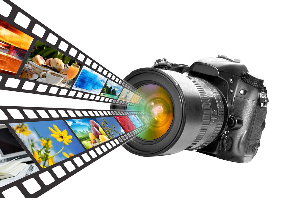 DSLR camera with colorful image strips flowing out of the lens.