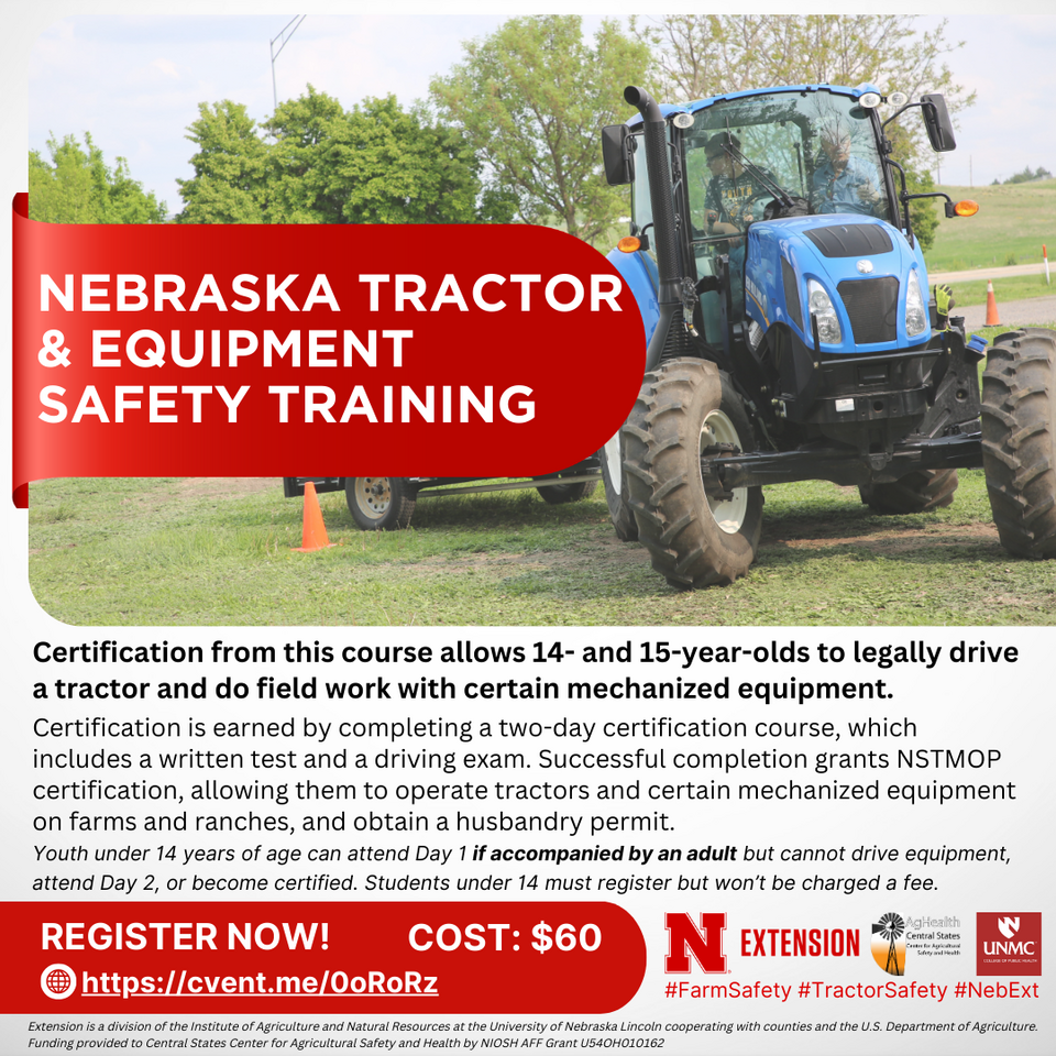 A blue tractor drives through a training course being driven by a youth. 