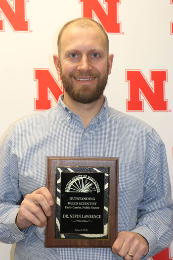 Nevin Lawrence with weed society award